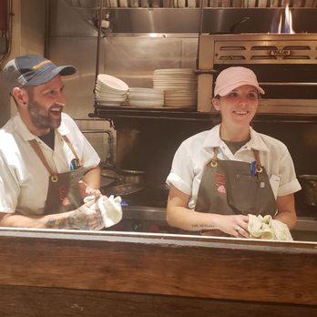 Rhubarb - Matt and Leaha sharing a laugh while making incredible meals. - New American Near Me - Asheville, North Carolina