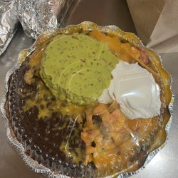 Fresh Tortillas & Taco - 22. Guacamole Nachos with added 52. Sour Cream