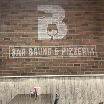 Bruno Bros Pizza - a brick wall and tables - Pizza Near Me - Youngstown, Ohio Bruno Bros Pizza - a brick wall and tables - Pizza Near Me - Youngstown, Ohio