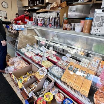 Barbara's Bagels - a woman standing in front of the counter - Caterers Near Me - Roslyn Heights, New York