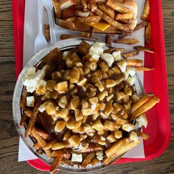 La Frite à Brigitte - Large poutine and a cheese dog.