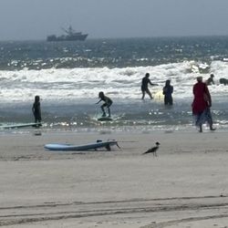 Ocean Outfitters - My 8 year old standing up on a surfboard on only day 2 of trying.