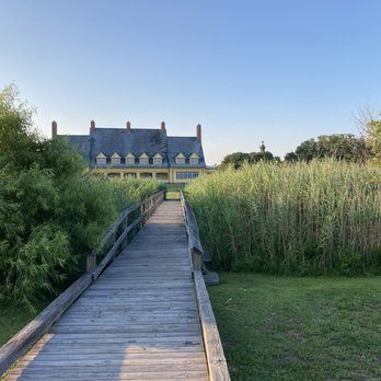 Cosmos Pizza - The wooden pathway leading to the Whalehead Club across the street from Cosmos - Pizza Near Me - Corolla, North Carolina Cosmos Pizza - The wooden pathway leading to the Whalehead Club across the street from Cosmos - Pizza Near Me - Corolla, North Carolina