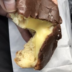 Glazed chocolate covered, Bavarian cream filled donut