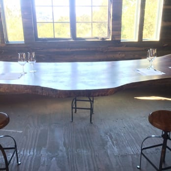 Phifer Pavitt - a table with wine glasses on it - Wineries Near Me - Calistoga, California Phifer Pavitt - a table with wine glasses on it - Wineries Near Me - Calistoga, California