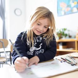 Fraser Woods Montessori School - Elementary student illustrates a creative wriritng piece at Fraser Woods Montessori School in Newtown, CT.