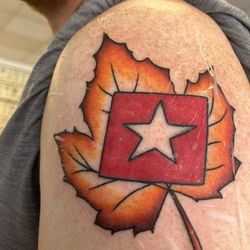 Ironside Tattoo & Piercing - My brother-in-law had the flag from when he did filming on the Titanic Wreck site. He had it touched up and a maple leaf added.