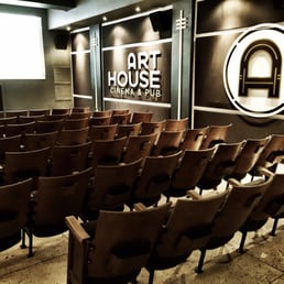 empty seats in front of a projector screen