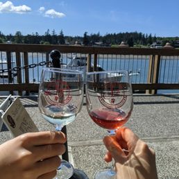 two people toasting wine glasses two people toasting wine glasses