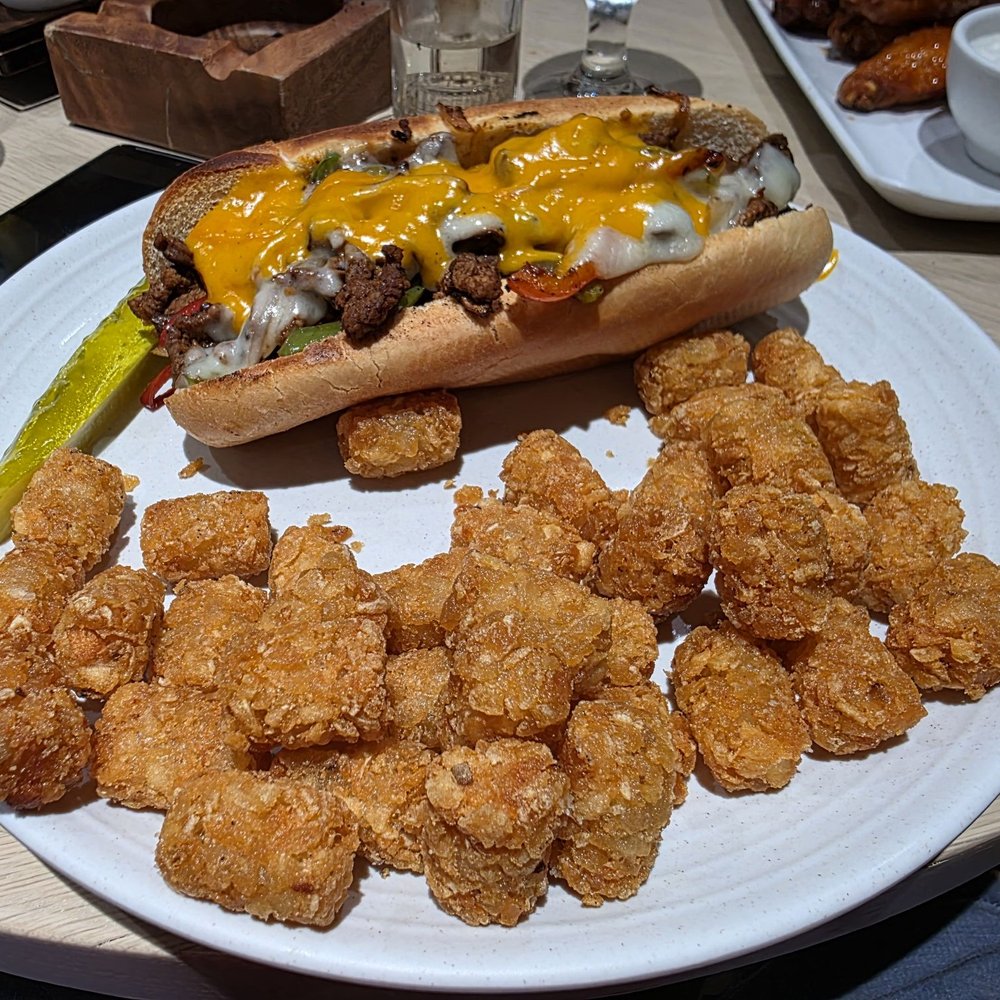 Red Falcon - Steak sandwich with tots - Smokehouse Near Me - Coachella, California Red Falcon - Steak sandwich with tots - Smokehouse Near Me - Coachella, California