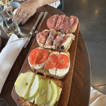 Postino Westminster - Bruschetta board  From top to bottom: Salami & Pesto Prosciuttto & Fig Tomato & Mozzerella  Brie, & Apple - Wine Bars Near Me - Westminster, Colorado