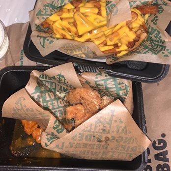 Wingstop - 8pc boneless with the 2 flavors of hot honey and garlic parmesan, with a side of cheese fries. - Chicken Wings Near Me - Columbia, South Carolina