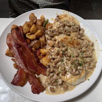 Toast Kitchen & Bar - Biscuits and gravy with house potatoes and bacon - Breakfast & Brunch Near Me - Brea, California Toast Kitchen & Bar - Biscuits and gravy with house potatoes and bacon - Breakfast & Brunch Near Me - Brea, California