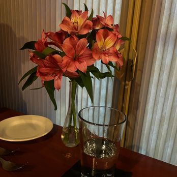 Catch Restaurant - a vase of flowers on a table - Seafood Near Me - Wilmington, North Carolina Catch Restaurant - a vase of flowers on a table - Seafood Near Me - Wilmington, North Carolina