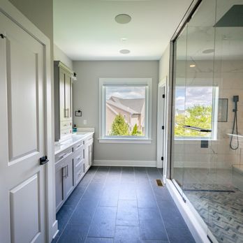 Four Seasons Construction - Bathroom with 8x6' walk in shower glass floor to ceiling. double vanity with tower in middle. Heated tile floors - General Contractors Near Me - East Petersburg, Pennsylvania Four Seasons Construction - Bathroom with 8x6' walk in shower glass floor to ceiling. double vanity with tower in middle. Heated tile floors - General Contractors Near Me - East Petersburg, Pennsylvania