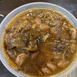 Side of grease with a few beans Side of grease with a few beans