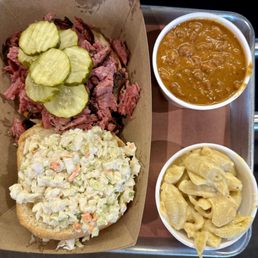 Pastrami sandwich with coleslaw & 2 sides, the cowboy beans and the Mac & cheese. Pastrami sandwich with coleslaw & 2 sides, the cowboy beans and the Mac & cheese.