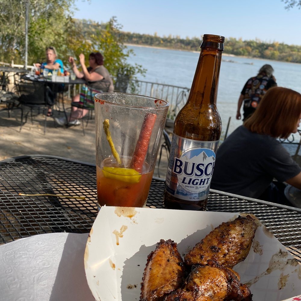a basket of chicken wings and a bottle of beer