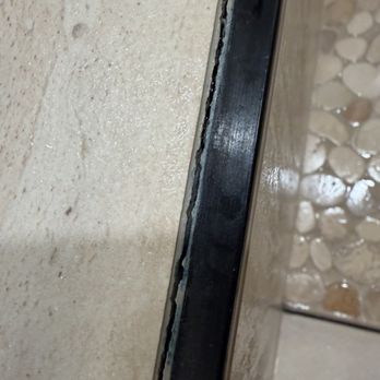 Green Leaf Remodeling - Big gap between metal and tile, grout corrupting letting water in - General Contractors Near Me - Colton, California