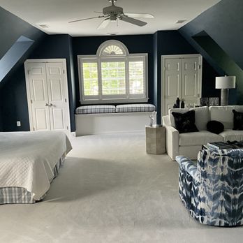 Classic Interiors - Dramatic dark blue paint dramatizes the white woodwork in this guest bedroom over a garage. - Furniture Stores Near Me Classic Interiors - Dramatic dark blue paint dramatizes the white woodwork in this guest bedroom over a garage. - Furniture Stores Near Me