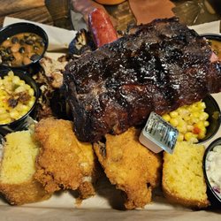 Riverhouse BBQ & Events - Family style dinner for 2. Great ribs. Excellent chicken. Average pulled pork. Dry beef brisket. Great cornbread. Average sides.