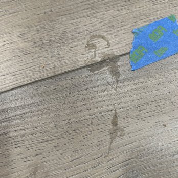 Great Western Flooring Co - Caulk tracked throughout new flooring - Carpeting Near Me - Naperville, Illinois