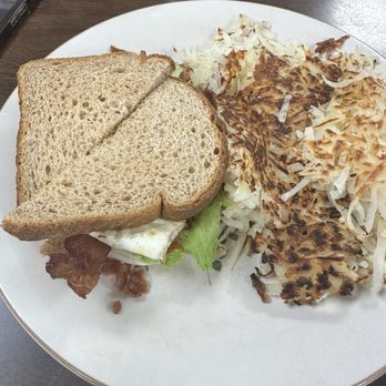 Tropical Palm Restaurant - BLT sandwich added a fried egg & cheese but the cheese was forgotten with a side of "extra crispy" hash browns. - Burgers Near Me - Crestview, Florida
