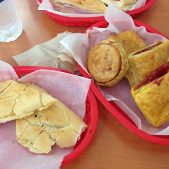 Pastelmania Bakery - Cuban bread with butter and 2 different types of pasteles: round with picadillo inside and rectangular with guava filling. - Latin American Near Me - Miami, Florida