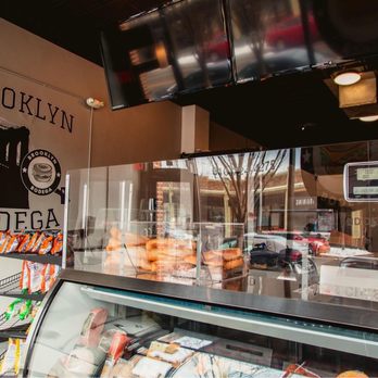 Brooklyn Bodega - a display of donuts in a deli - Breakfast & Brunch Near Me - Grand Rapids, Michigan Brooklyn Bodega - a display of donuts in a deli - Breakfast & Brunch Near Me - Grand Rapids, Michigan