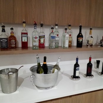 VIP Lounge Latam - bottles of liquor on a bar counter - Airport Lounges Near Me - Miami, Florida VIP Lounge Latam - bottles of liquor on a bar counter - Airport Lounges Near Me - Miami, Florida