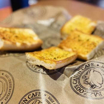 Razzoo's Cajun Cafe - two pieces of bread on a paper bag - Cajun/Creole Near Me - Round Rock, Texas Razzoo's Cajun Cafe - two pieces of bread on a paper bag - Cajun/Creole Near Me - Round Rock, Texas