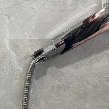 Rebath Heaven - The handheld shower is resting on the shower valve. - General Contractors Near Me - Hialeah Gardens, Florida Rebath Heaven - The handheld shower is resting on the shower valve. - General Contractors Near Me - Hialeah Gardens, Florida