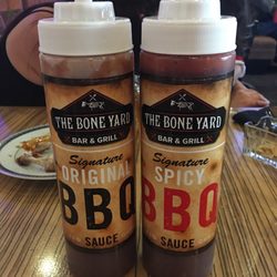 The Bone Yard Bar & Grill - BBQ sauces are very good. The spicy has a good kick and builds the more you eat.