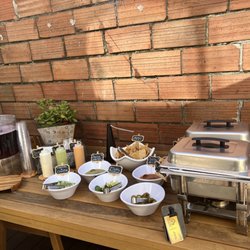 Chuy Tacos - Oakland- awesome set up with wood table & brick background.