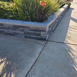 Corner driveway retaining wall. Corner driveway retaining wall.