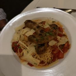 Angel hair pasta with grilled Italian sausage. Angel hair pasta with grilled Italian sausage.