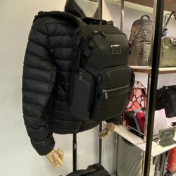 Tumi Luggage store - Jacket and backpack