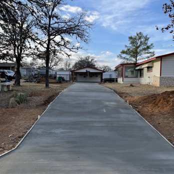 Wisdom Construction - Tore out old asphalt and formed up the driveway and then poured a concrete driveway for a client in granite shoals. - General Contractors Near Me Wisdom Construction - Tore out old asphalt and formed up the driveway and then poured a concrete driveway for a client in granite shoals. - General Contractors Near Me