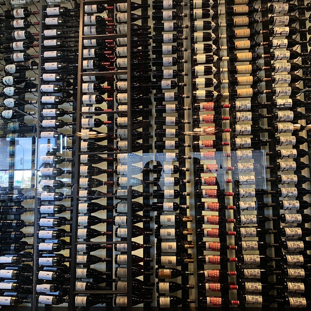JOEY Mayfield - a wall of wine bottles in a wine cellar - Canadian (New) Near Me - Edmonton, Alberta JOEY Mayfield - a wall of wine bottles in a wine cellar - Canadian (New) Near Me - Edmonton, Alberta