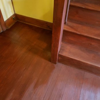 RJ Construction - a wood floor with a yellow wall - General Contractors Near Me RJ Construction - a wood floor with a yellow wall - General Contractors Near Me