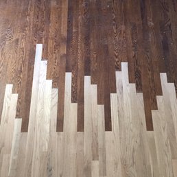 Lacing new wood into existing wood. It was then sanded and stained to match the wood they installed two years earlier.