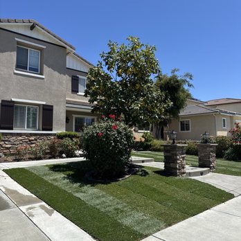 JC & Sons Landscaping - View of the finished walkway in the daytime. - Landscaping Near Me