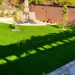 a backyard with artificial grass a backyard with artificial grass