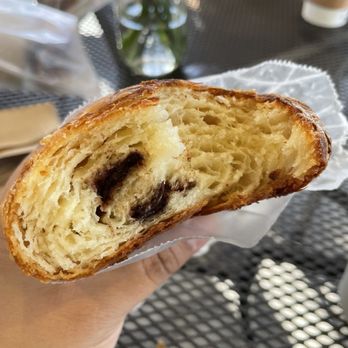 Cruise Coffee Cafe - a person holding a pastry - Cafes Near Me - Scotts Valley, California