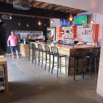 Firebox Deli - Side view of the entryway, bar, and kitchen window. - Barbeque Near Me - Saint Paul, Minnesota