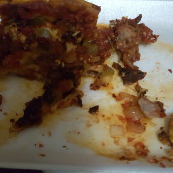 Beggars Pizza - What is this black crap on a sausage, green peppers, and onions deep dish? - Pizza Near Me - Lansing, Illinois