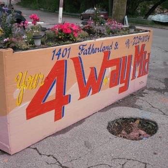 4 Way Market - a planter with flowers in it - Grocery Near Me - Nashville, Tennessee 4 Way Market - a planter with flowers in it - Grocery Near Me - Nashville, Tennessee