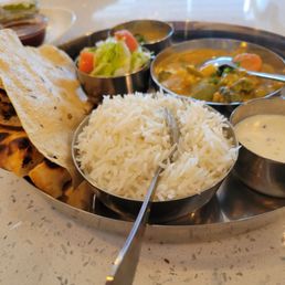 This was the vegetables Korma lunch special with a bean deal, toasted naan bread, basmatu rice and a sweet, stick rice.