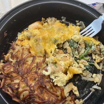 Prawn scramble with hash browns.