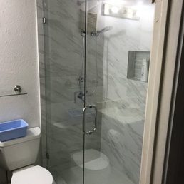 marble looking tile to ceiling, frameless shower doors by dallas bath and glass